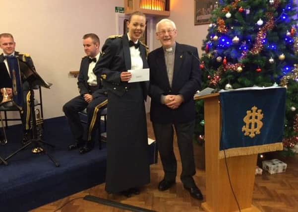 The cheque presentation of funds raised by the carol concert.