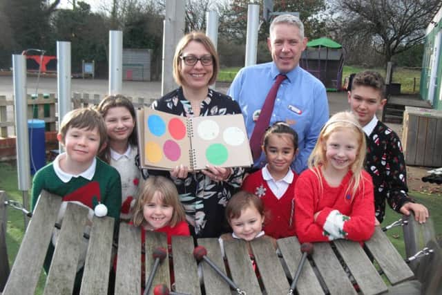 Leasingham St Andrew's School deputy headteacher Judith Bentley bids farewell to pupils and headteacher David Hodgson at the end of term and is due to take charge at Heckington's primary school. EMN-171227-114943001
