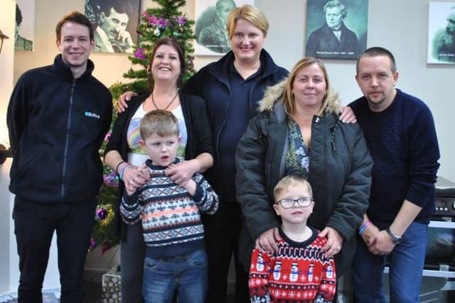 Butlers choose their charity for the year. From left - (back) electrician Liam North, Rainbow Stars founder Jane Peck, Butlers Company Secretary Kate Cook, Rainbow Stars committee member Tara Tregent, Jane's husband Adrian and (front) Dylan and Aiden Peck. EMN-171227-122823001