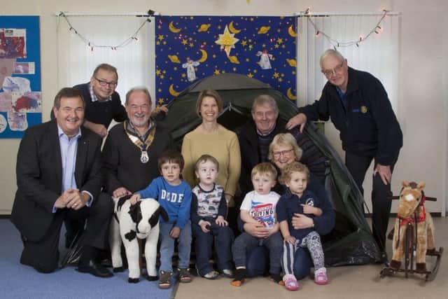 Members of the Rotary Clubs of Sleaford Kesteven and Woodhall Spa have donated ?500 to the TimTin Playgroup in Martin. EMN-171228-094656001