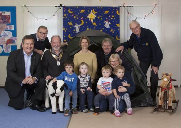 Members of the Rotary Clubs of Sleaford Kesteven and Woodhall Spa have donated ?500 to the TimTin Playgroup in Martin. EMN-171228-094656001