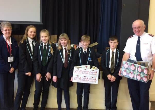 Kirton's Thomas Middlecott Academy makes its donation to the Salvation Army.