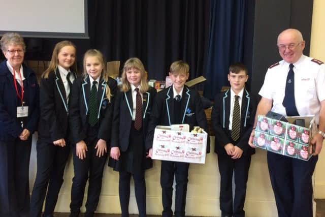 Kirton's Thomas Middlecott Academy makes its donation to the Salvation Army.