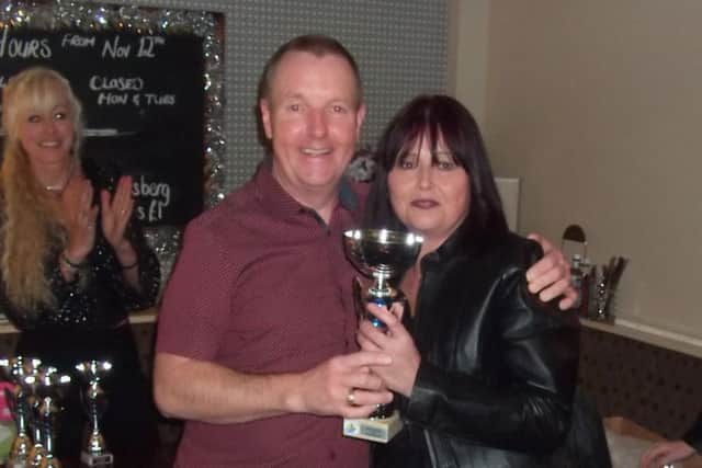 Chairman Wayne Kew with the club's Most Improved Member, Cara Dixon EMN-171227-152730002