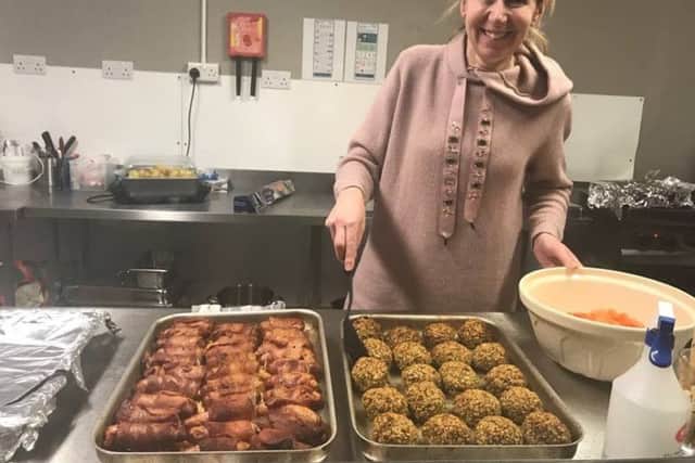 Volunteer Kay Ellis helping to serve up the Christmas dinner for the homeless at the Storehouse in Skegness. ANL-171227-152623001