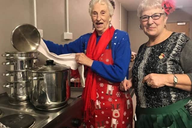 Volunteers Jean Allen and Shirley Noble checking the vegetables at the festive lunch held at the Storehouse in Skegness for the homeless. ANL-171227-152108001