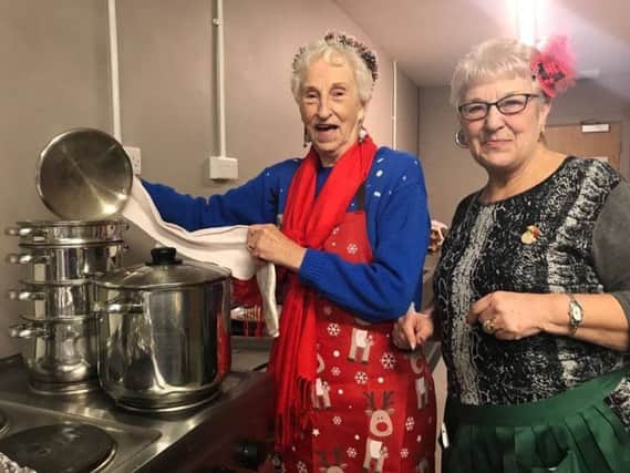 Volunteers Jean Allen and Shirley Noble checking the vegetables at the festive lunch held at the Storehouse in Skegness for the homeless. ANL-171227-152108001