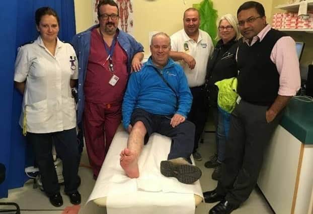 Timothy (centre) and his wife Angela with the Pilgrim team, from left to right, Sian Talbot (Staff Nurse), Piermauro Castino (Specialty Doctor), Martin Tomlin (Plaster Technician) and Mr Kurup. ANL-171228-082231001