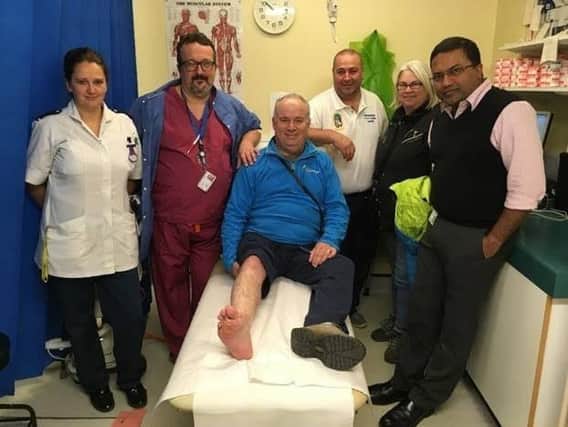 Timothy (centre) and his wife Angela with the Pilgrim team, from left to right, Sian Talbot (Staff Nurse), Piermauro Castino (Specialty Doctor), Martin Tomlin (Plaster Technician) and Mr Kurup. ANL-171228-082231001