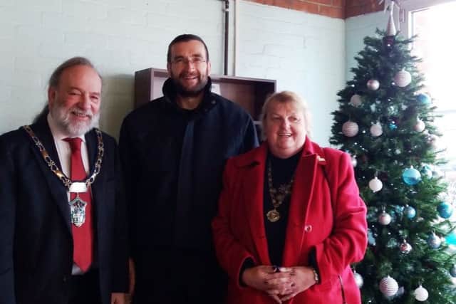 Pictured is: Councillor Tony Howard, Michael Collins and June Howard.
