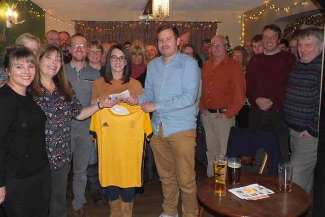 Members of Horncastle Hockey Club join pub regulars and staff at the presentation night. Photo: Supplied