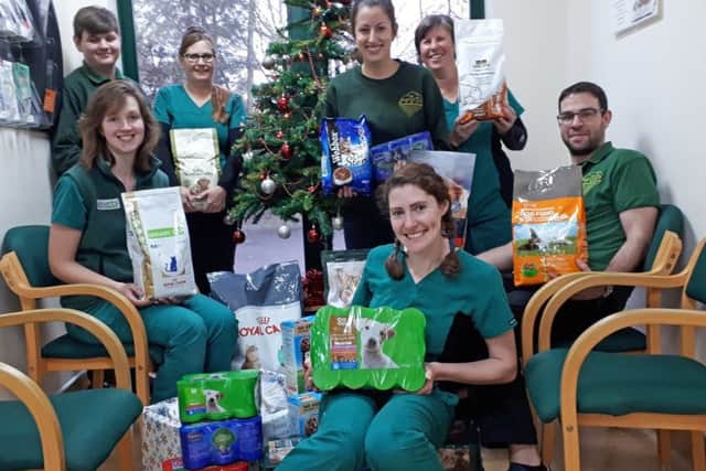 Skegness staff with some of the food collected in the Fenwold Vets ran their usual Give a Stray a Christmas Dinner campaign. ANL-171229-160235001