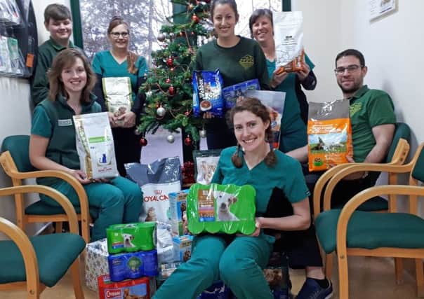 Skegness staff with some of the food collected in the Fenwold Vets ran their usual Give a Stray a Christmas Dinner campaign. ANL-171229-160235001