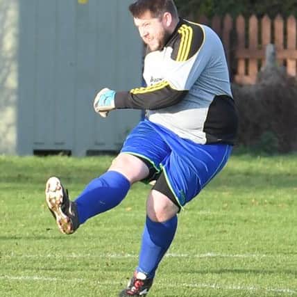 Swineshead Res (blue) v Woodhall Spa Utd (red). Andrew Money.