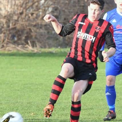 Swineshead Res (blue) v Woodhall Spa Utd (red). Ross Dixon.