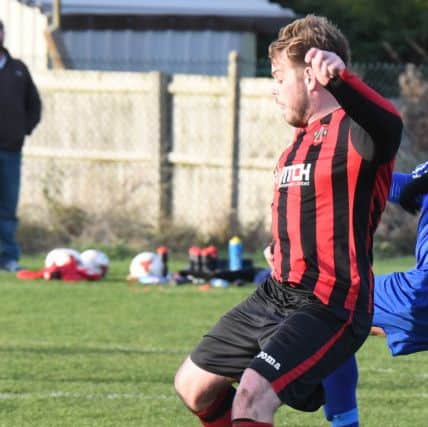 Swineshead Res (blue) v Woodhall Spa Utd (red). Chris Hall.