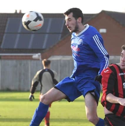 Swineshead Res (blue) v Woodhall Spa Utd (red). Lee Bradley.