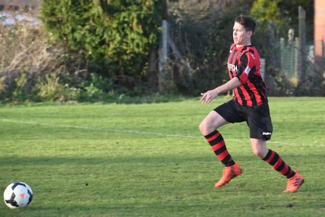 Swineshead Res (blue) v Woodhall Spa Utd (red). Ross Dixon.