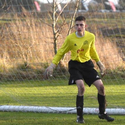 Swineshead Res (blue) v Woodhall Spa Utd (red). Ben Troops.