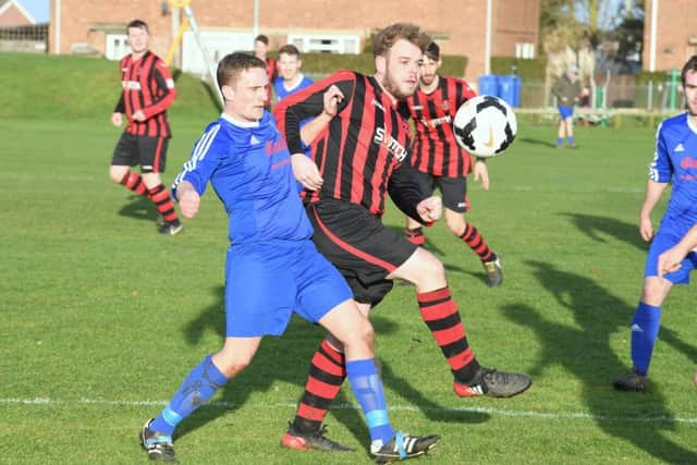 Swineshead Res (blue) v Woodhall Spa Utd (red). John Prue (blue), Chris Hall (red).