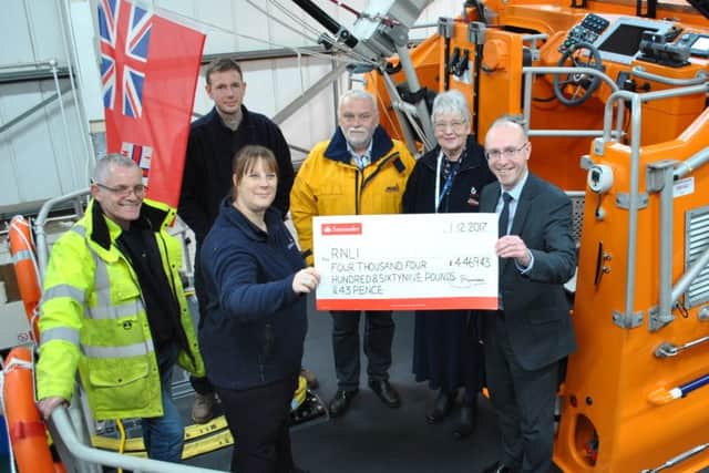Pictured from left to right is: Alan Gordon-Griffiths, part of the shore crew; Sarah Whattam, RNLI East Midlands Community Fundraising Manager; Craig Willard, Station Mechanic; Richard Watson, Coxswain; Anne May, Fundraising Secretary; Nick Chambers, Chief Executive of LACE Housing.