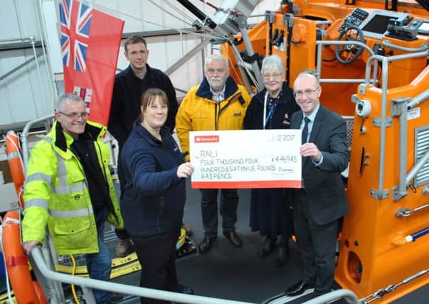 Pictured from left to right is: Alan Gordon-Griffiths, part of the shore crew; Sarah Whattam, RNLI East Midlands Community Fundraising Manager; Craig Willard, Station Mechanic; Richard Watson, Coxswain; Anne May, Fundraising Secretary; Nick Chambers, Chief Executive of LACE Housing.