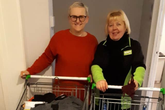 Asda, in Boston, passes on the items it received during a Christmas appeal in aid of Centrepoint Outreach. Pictured are Centepoint Outreach project worker Liz Steadman (left) and Asda's Tina Brown.