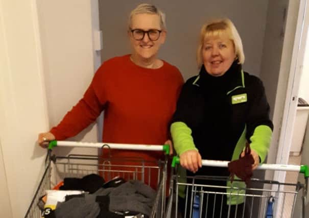 Asda, in Boston, passes on the items it received during a Christmas appeal in aid of Centrepoint Outreach. Pictured are Centepoint Outreach project worker Liz Steadman (left) and Asda's Tina Brown.