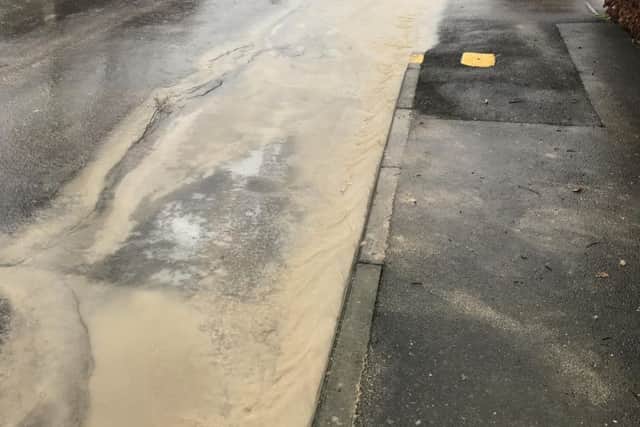 Rainwater streaming onto Osborne Way. EMN-180201-143512001