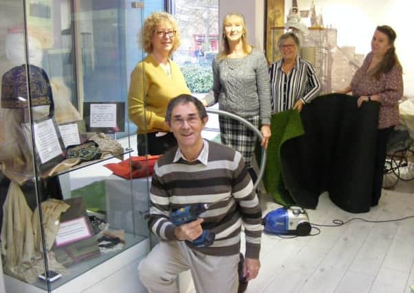 Putting the finishing touches to the refurbishments at Sleaford Museum. From left - Evelyne Bryant (secretary), David Marriage (chairman), Jacqui Cleaver (curator), Janice Smith (team member) and Heather Jenvey (archivist). EMN-180501-121556001