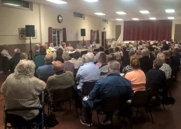 A packed public meeting in Coronation Hall last year when residents and councillors voiced strong objections to  development plans in Woodhall Spa.