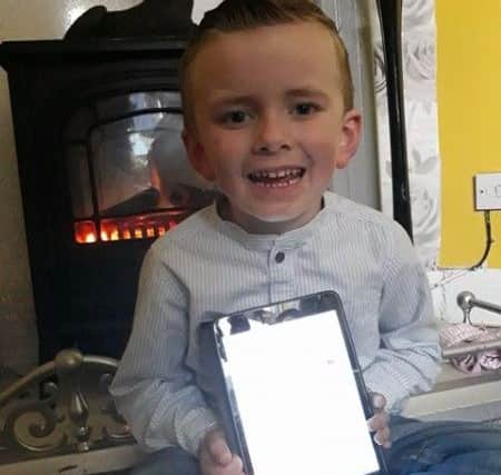 Leyland Middleton with the iPad from the 'People of Boston'. Photo: supplied