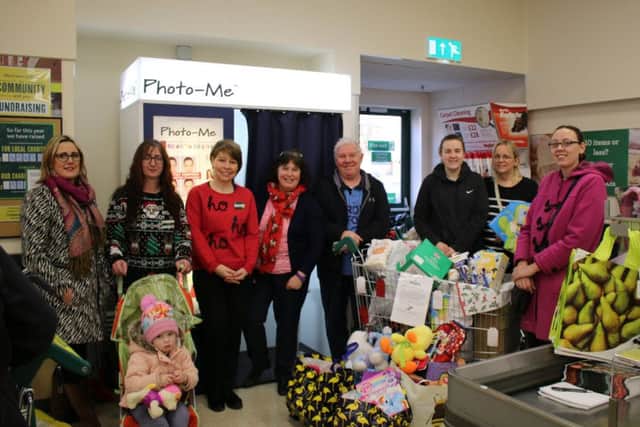 Pictured are Morrisons staff and reps from homestart and the food larder.