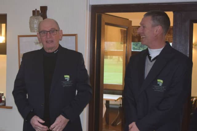 Outgoing captain Stu Thomas is pictured handing the blazer to new captain Barry Hunt.