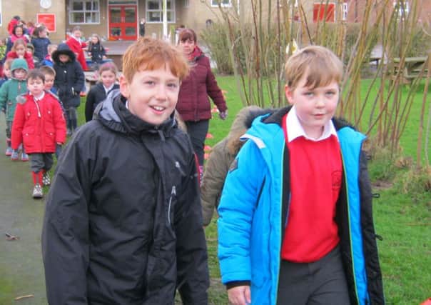 Kirkby La Thorpe school children on their welly walk to help African farmers. EMN-180116-111604001