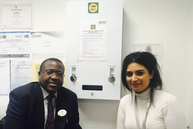 Chris Mulimba, from Riverside Pharmacy and Dimple Oza from Addaction with the pioneering needle dispensing machine. EMN-180116-131923001