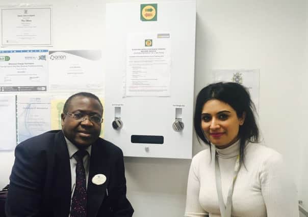 Chris Mulimba, from Riverside Pharmacy and Dimple Oza from Addaction with the pioneering needle dispensing machine. EMN-180116-131923001