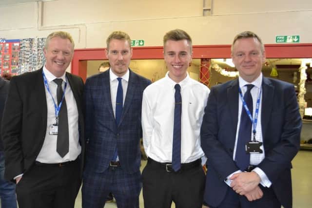 From left - Alan Brogan, Philip Everett of the EBP, former Year 11 Joseph Ablewhite with Mark Guest - headteacher. EMN-181201-134747001