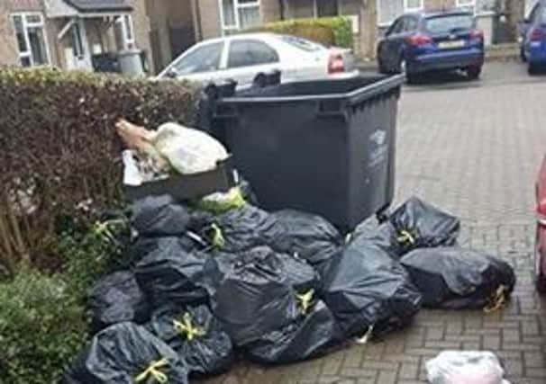 Rubbish overflowing from an industrial bin serving six flats in Cranwell Close. Now tenants have been told they will get individual bins. ANL-181201-123233001