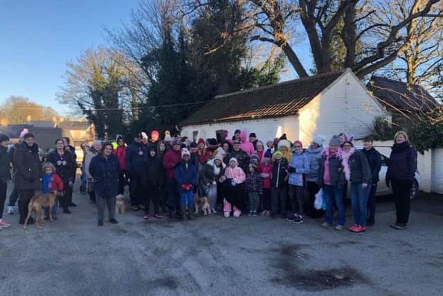 A recent walk in Alford has raised over £400 for two cancer causes.