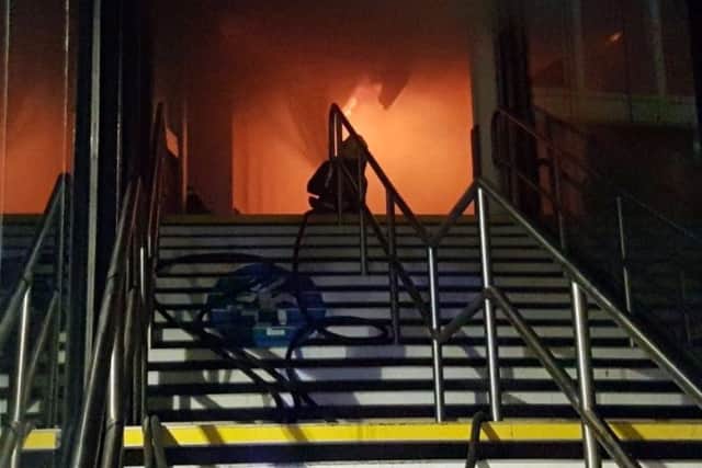 Firefighters battling the flames on the main concourse of Nottingham railway station. EMN-181201-114659001