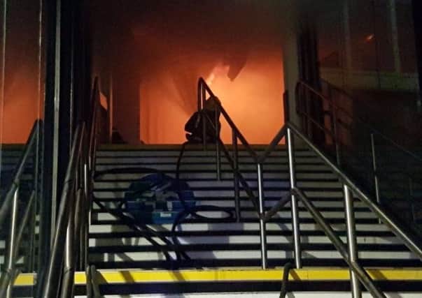 Firefighters battling the flames on the main concourse of Nottingham railway station. EMN-181201-114659001