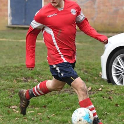 Railway Athletic (blue) v Ruskington Rovers (red). Sam Jackson.