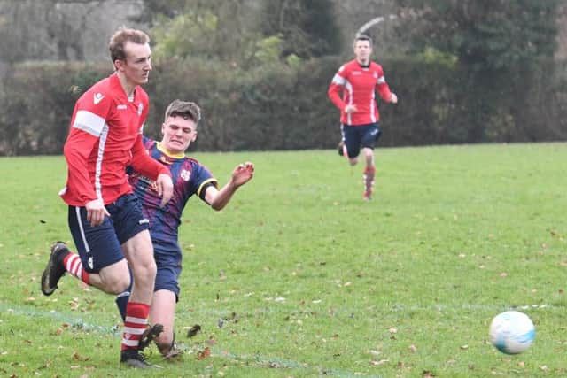 Railway Athletic (blue) v Ruskington Rovers (red). Liam Tait.