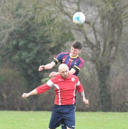 Railway Athletic (blue) v Ruskington Rovers (red). Harry Cramfield (blue), Ash Farmer (red).