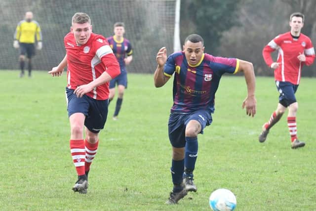 Railway Athletic (blue) v Ruskington Rovers (red). Curtis Yateman (blue), Robert Parker-Meadows (red).