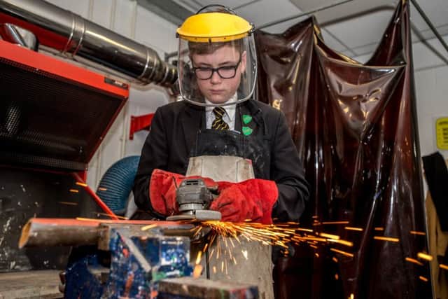 The sparks really are flying as Year 9 pupil Ollie Robinson shows his skills while working at the schools forge. Picture: John Aron