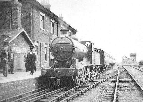 A bygone agfe: A steam train wauts at the platform at the long-sice demolished Horncastle Railway Station, Photo: Heritage and History Society. EMN-180901-164543001