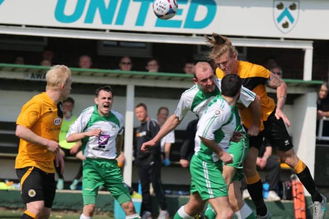 Carl Piergianni and Tom Denton battle in North Ferriby, the last time the Pilgrims visited.