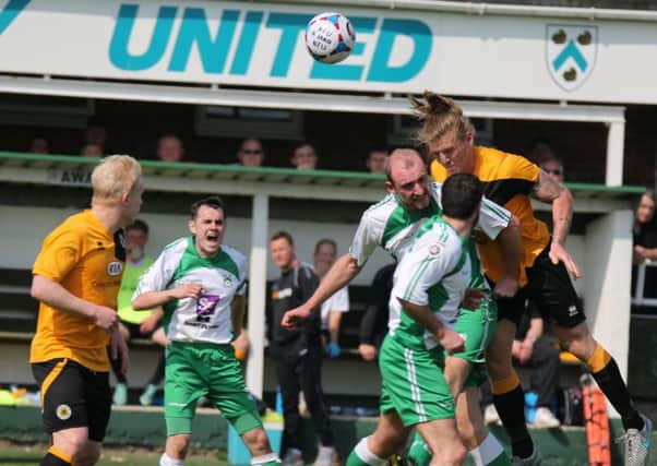 Carl Piergianni and Tom Denton battle in North Ferriby, the last time the Pilgrims visited.